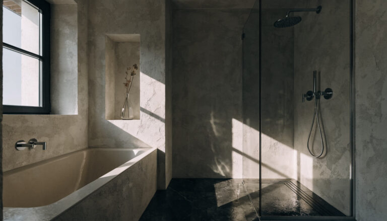 Shower enclosure beside a freestanding bathtub
